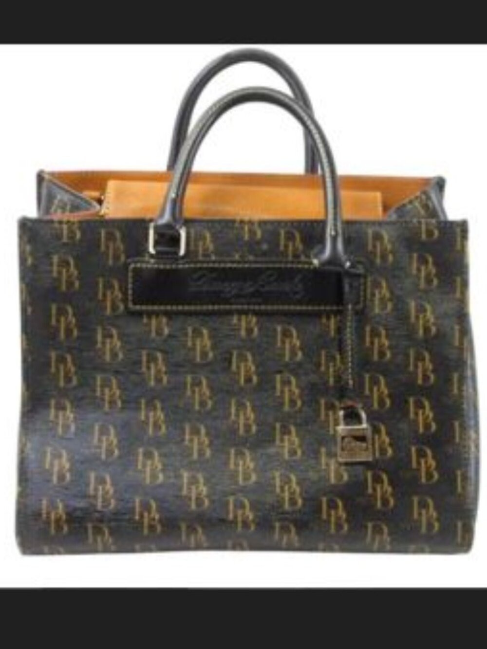 Dooney & Bourke Mdl: DB 1975 Tote Material: Genuine Florentine Vachetta Leather
